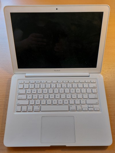 The Mid-2010 MacBook, Crabapple, when open, showing the all-white finish.